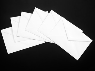White business envelopes. set of letters envelopes isolated on black background.