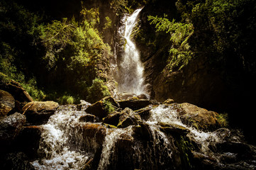 Naklejka na ściany i meble Chibitsky waterfall in the Altai mountains, Russia