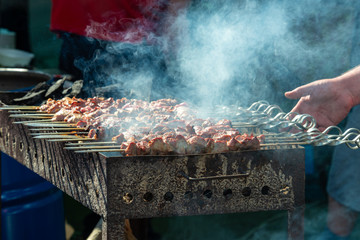 Making barbecue kebab shashlik on wooden coal grill meat food fresh health beacon pork eat