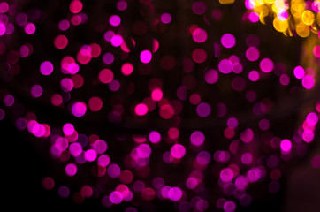 Abstract soft blurred bokeh on black background. Shining and blurred circles lights bokeh background. For used wallpaper texture and background.