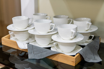 Group of empty cups, in many rows of white cup for service tea or coffee in breakfast or buffet and seminar event.