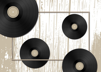 Music concept with vinyl discs on old wood background.