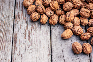 Walnuts close-up on a wooden background.