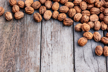 Walnuts close-up on a wooden background.