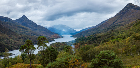 Naklejka na ściany i meble a high viewpoint over loch leven in the argyll region of scotland near kinlochleven and fort william on the west highland way showing loch waters and cloudy skies in autumn