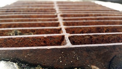 Old rusty water drainage close-up