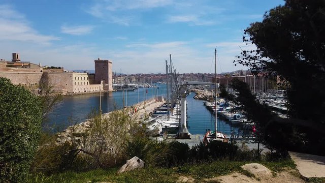 Marseille city, France. Panoramic view on old harbor and sailboats. UHD 4K cinematic stock footage about French Riviera, Mediterranean Coast, South European life, travel, culture.