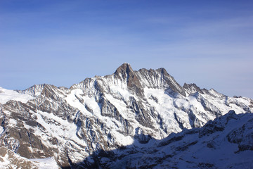 snow-covered mountains in the bernese alps in winter