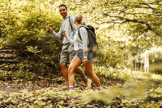 Young couple hiking in nature.They enjoying in walk and fresh air.