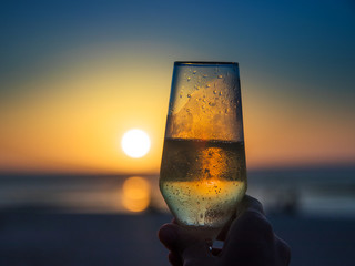 Champagne glass in the sunset