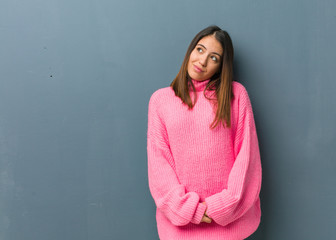 Fototapeta premium Young modern woman dreaming of achieving goals and purposes
