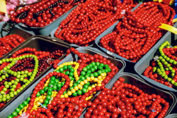 Red beads made of wood. Close-up. Brightly.