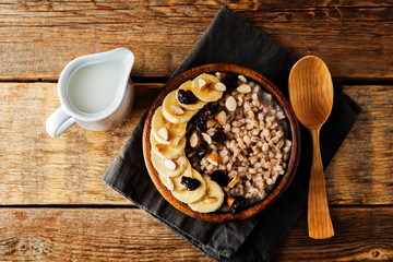 Barley porridge with banana slices and almonds