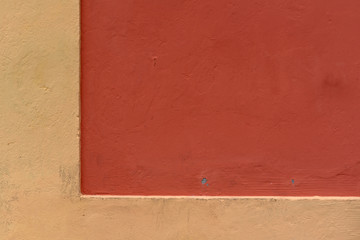 House wall with yellow and red angle
