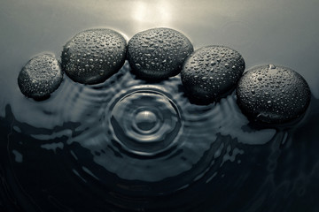 shiny zen stones with water drops. Top view