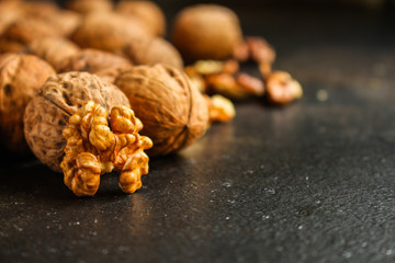 Fototapeta premium Walnuts, tasty and healthy (Kernels, whole nuts) menu concept. food background. copy space. Top view