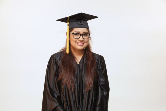 Portrait of a young hispanic female graduate