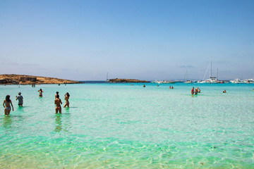 Fototapeta premium man and woman on beach formentera