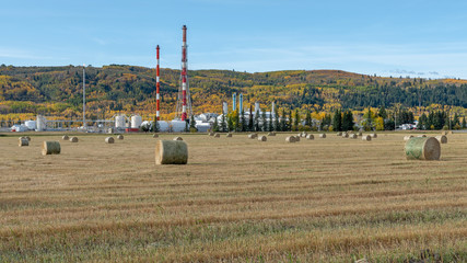 Gas Plant beside a Hay Field