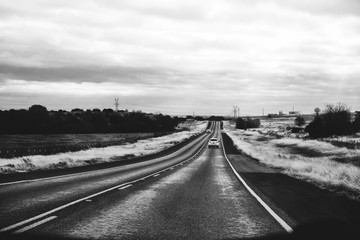 Rural country road, travel concept in black and white.