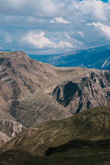 Fototapeta premium Remote highlands landscape with mountain peaks in the distance