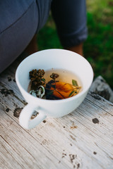 Mug with herbal decoction, Collection of medicinal herbs Wild herbs Treatment 
