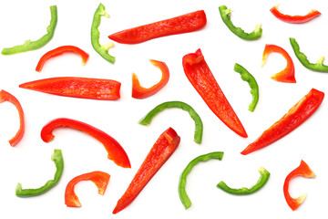 cut slices of sweet bell pepper isolated on white background. top view
