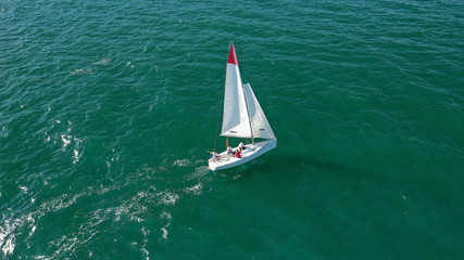 Aerial drone photo of white Sailing boats compete during sailing regatta practise in open ocean exotic sea