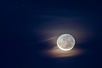 Waxing crescent moon as seeing from the southern hemisphere. Amazing the moon rough surface full of craters from meteorites coming from the universe and crashing our satellite the Moon an awe relief
