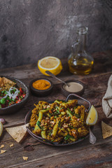 Deep Fried Cauliflower with eggplant salad and crusty bread, copy space