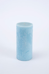 Blue candle on the white isolated background