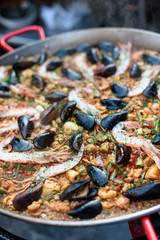 Cooking Spanish Seafood Paella in Traditional Pan