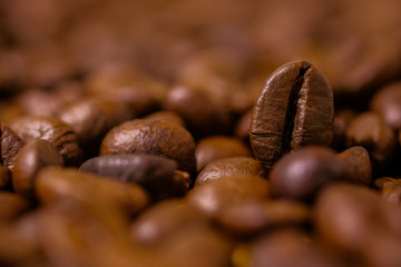 Preparing roasted coffee beans up. Photo filtered in vintage style can be used as a background 