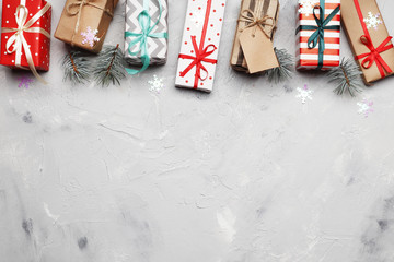 Flat lay composition with Christmas gifts, .on a gray background with place for text. Top view