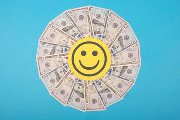 Smile faces on kaleidoscope from money.