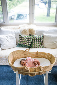Newborn baby in cradle