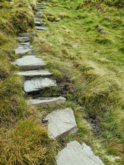 Stone path in a mountains for hikers, Diamond hill, Connemara National park, county Galway, Ireland.