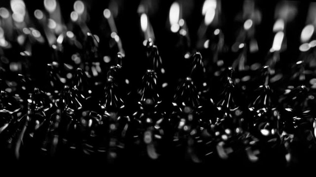 Super Slow Motion Macro Shot of Magnetic Liquid Ferrofluid in Motion at 1000fps. Shooted with High Speed Cinema Camera at 4K.