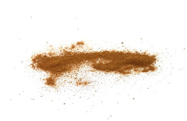 Spice cinnamon powder isolated on a white background. Cinnamon powder spilled on a white surface.