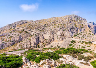 Fototapeta na wymiar Scenic, windy road to Cap de Formentor in Mallorca island, Spain. View from Formentor Lighthouse towards mountains on the peninsula