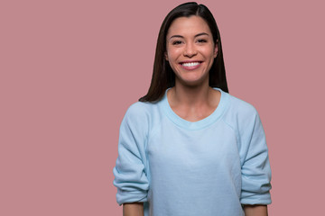 Casual beautiful young asian american isolated portrait on pink background, genuine sincere smile...