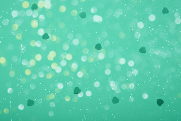 Abstract composition. Greeny blue mint leaf glitter light background with beautiful bokeh and hearts