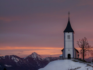 Fototapeta premium Morning symphony St. Primus and Felician church in Jamnik, Slovenia.