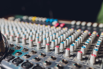 the mixer. remote for sound recording. sound engineer at work in the studio. sound amplifier mixing...