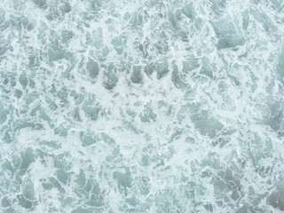 Abstract texture of water with waves. Top view of turquoise water as a background, ocean, sea, lake