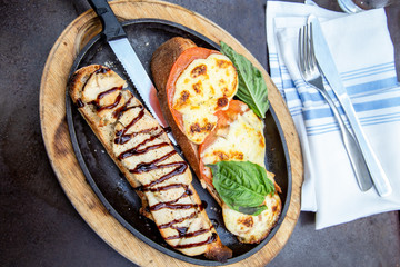 Chicken with balsamic, basil, tomato and cheese on a baguette