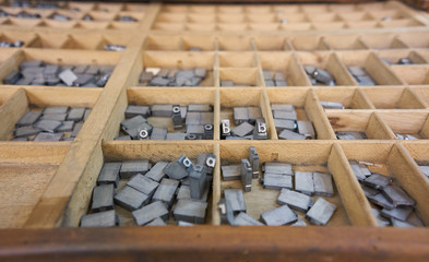 Mobile typographic characters collected in a drawer for typography. Collection of old typographic...