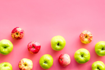 Autumn composition with fresh apples on pink background top view pattern copy space