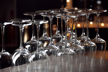 Empty clean glasses on counter in bar