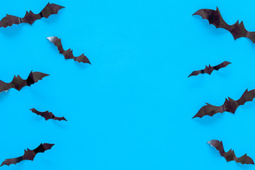 Bats cutout on Halloween frame on blue table top view space for text